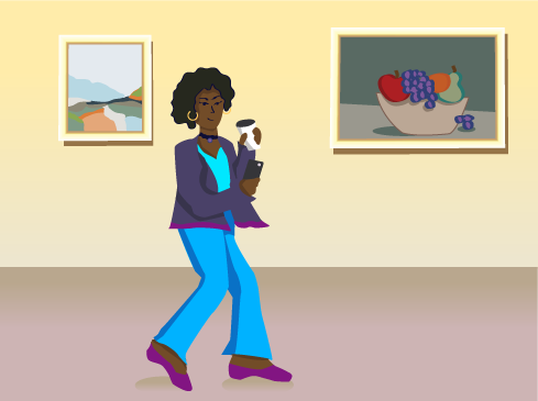 woman walking in museum looking at phone and holding coffee